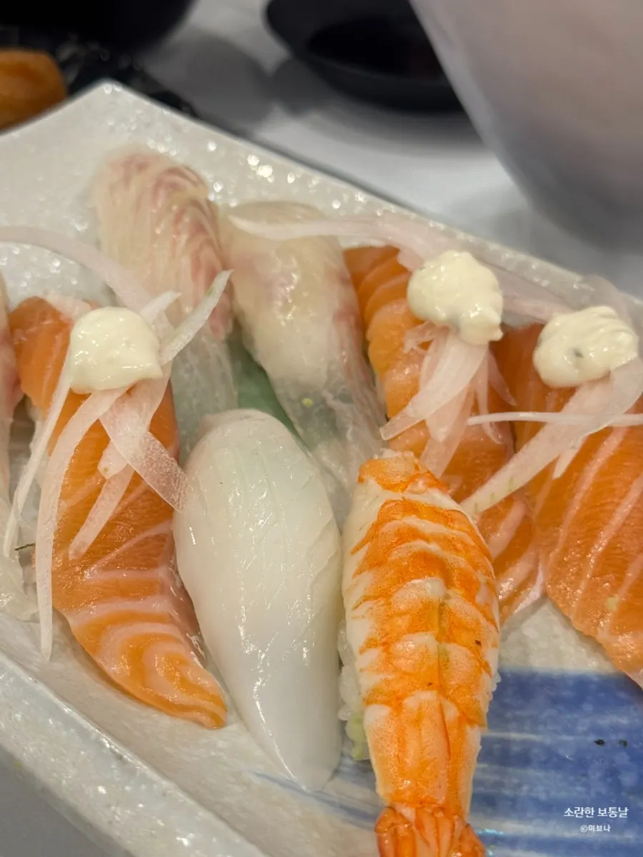 Sushi with thick slices of fish on top