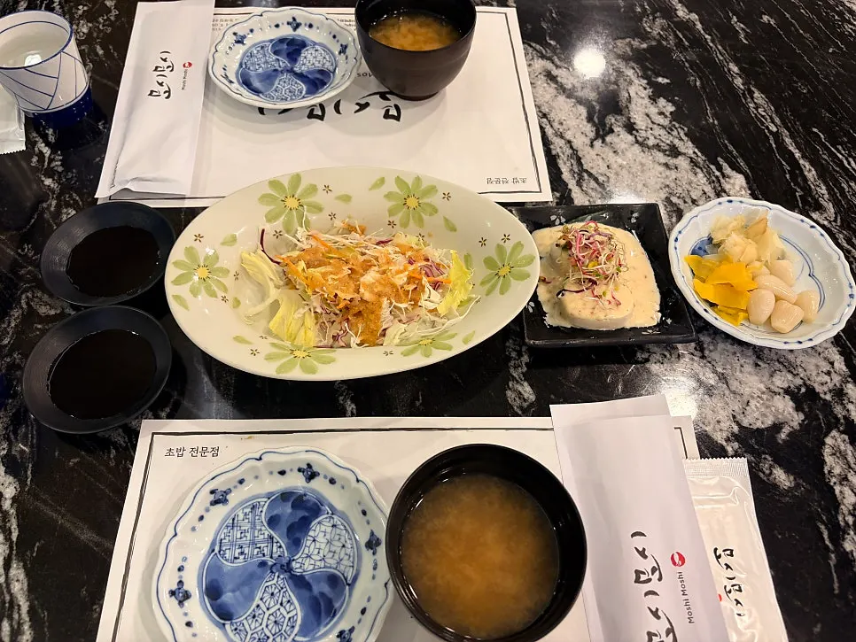 Salad, soup, and ginger side dishes served first