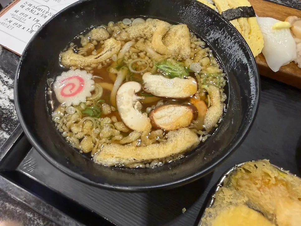 Udon and tempura served with the sushi platter