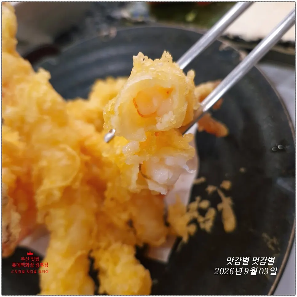 Plump shrimp tempura bitten in half