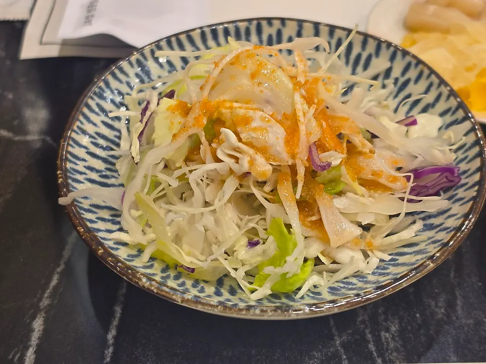 Neatly arranged side dishes at Moshi Moshi Sushi