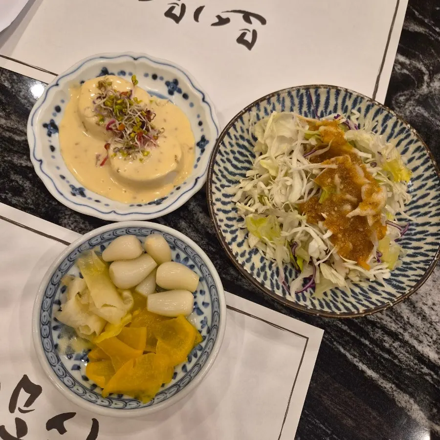 Sign for the Naver receipt review event offering 2 pieces of shrimp sushi