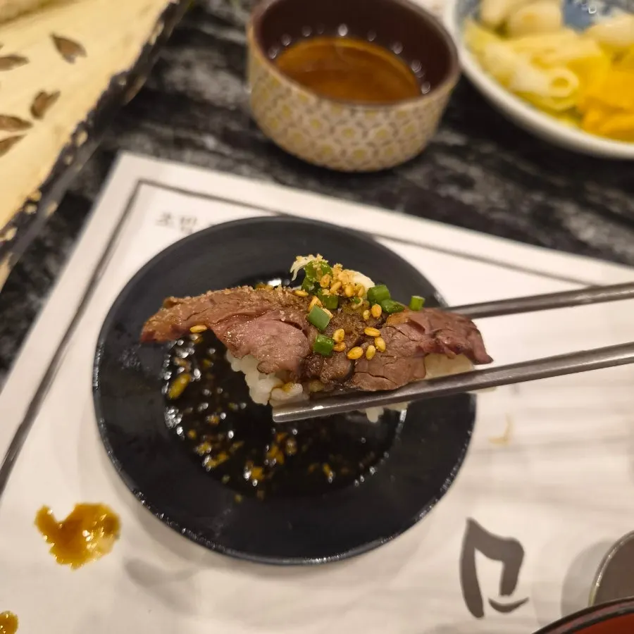Plate with abalone sushi and salmon sushi