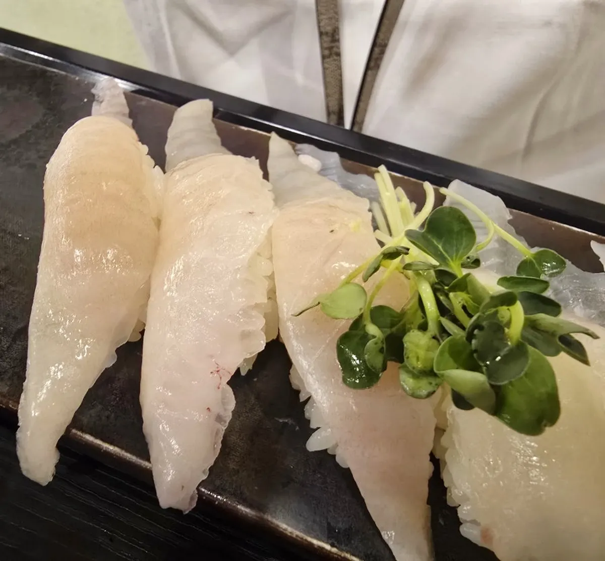 Plate of well-aged white fish nigiri at Moshi Moshi Sushi