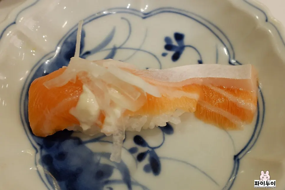 Close-up of a piece from the premium sushi set