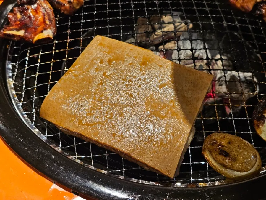 Pork ribs and a bowl of rice meal spread