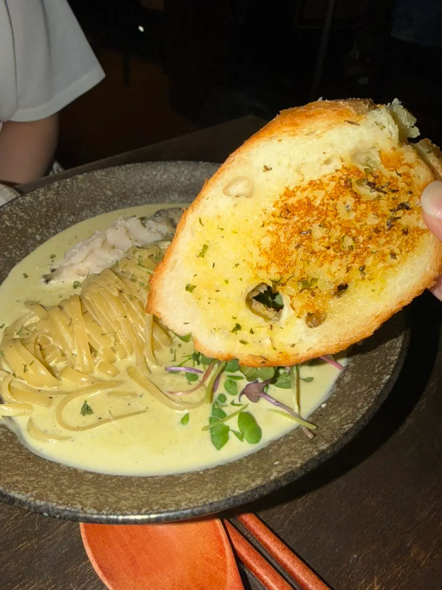 Cream pasta noodles with abalone mixed in
