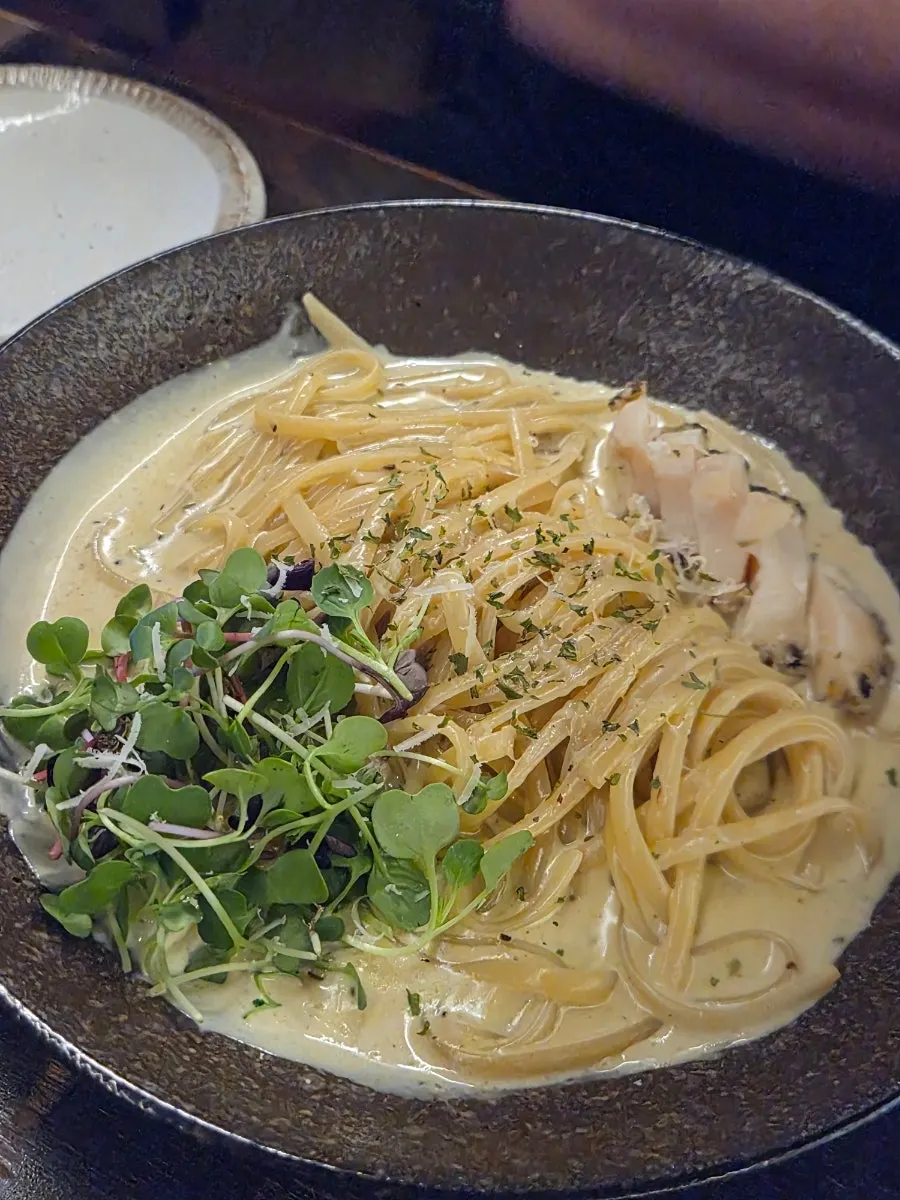 Serving out the abalone innard pasta