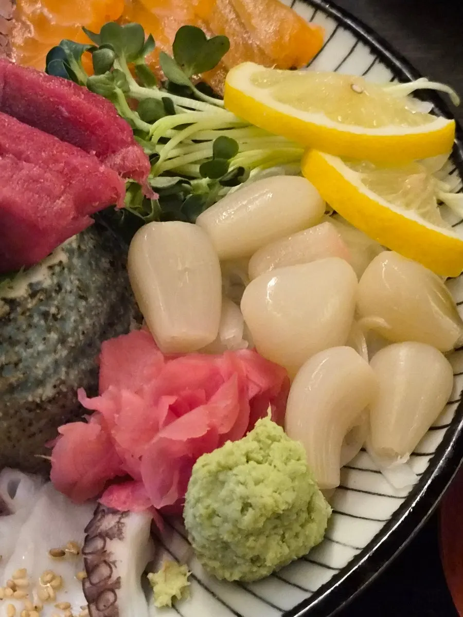 Sampling the different kinds of sashimi at Motokurashi