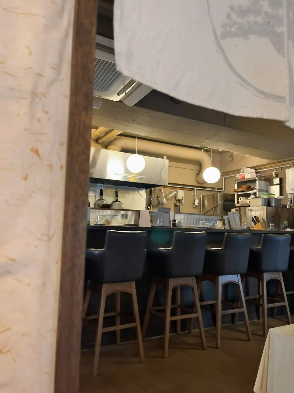 Counter seats at Motokurashi connected to the kitchen