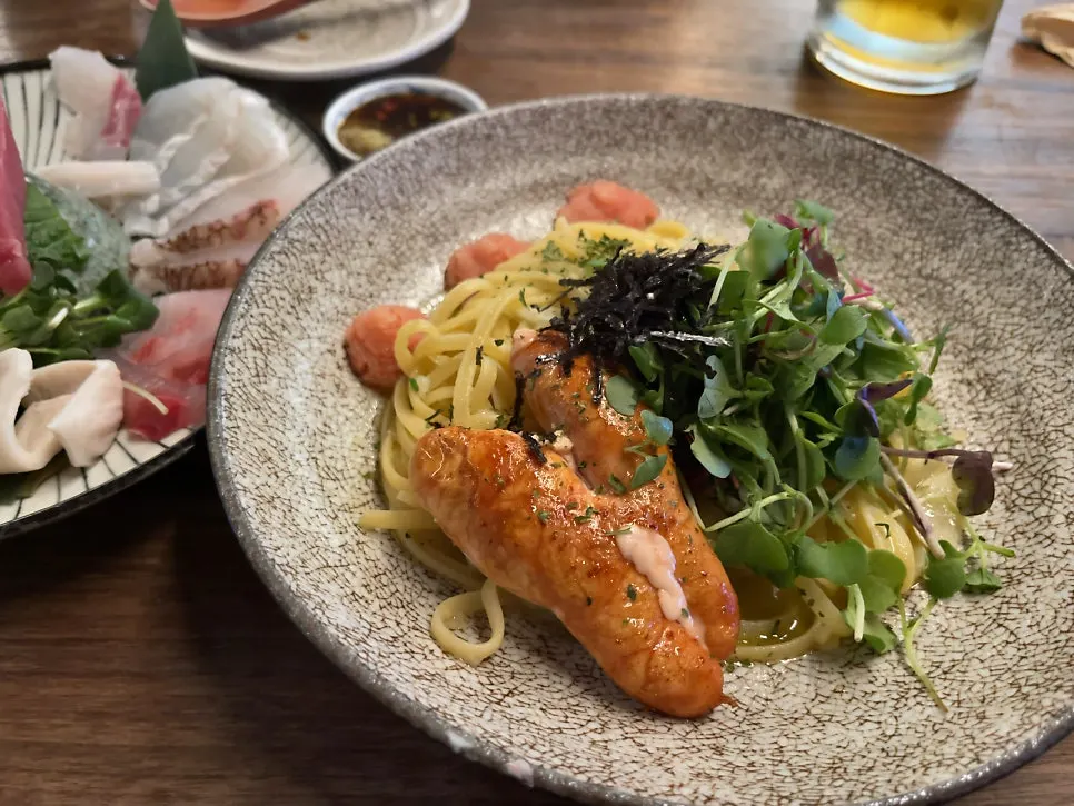 Plump mentaiko piled on an oil-based pasta