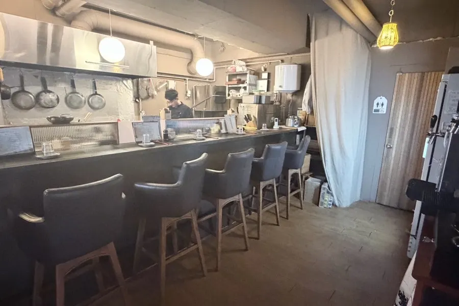 Izakaya interior with generous table spacing