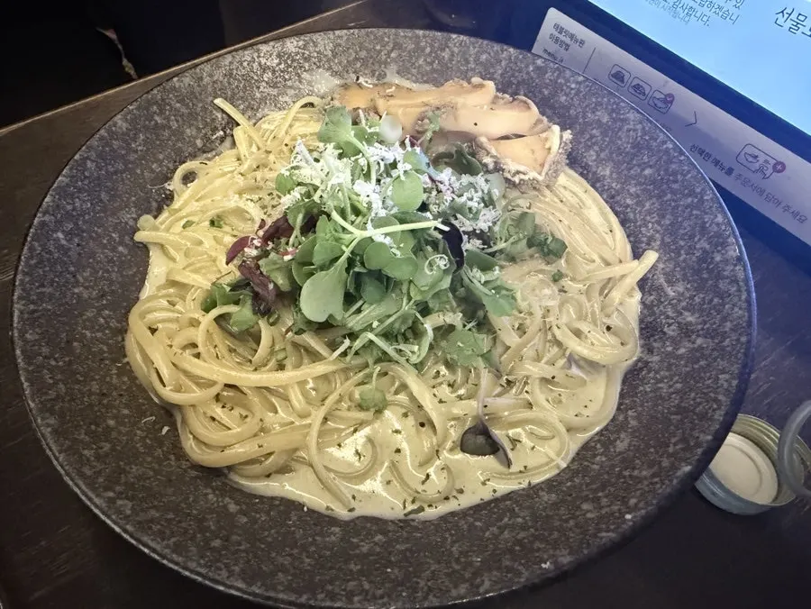 Abalone innards pasta topped with large abalone pieces