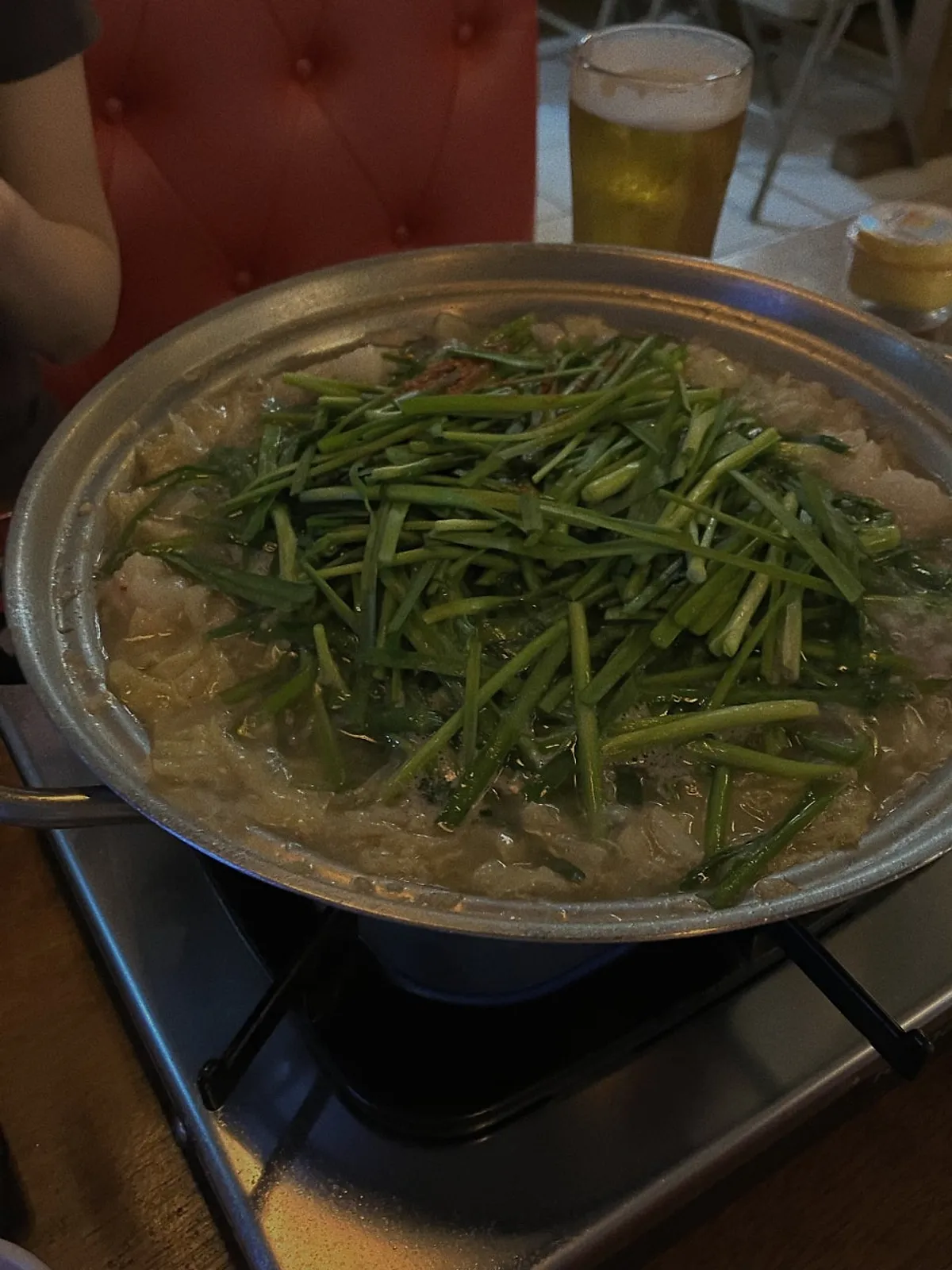 Soy sauce motsunabe with plenty of garlic chives