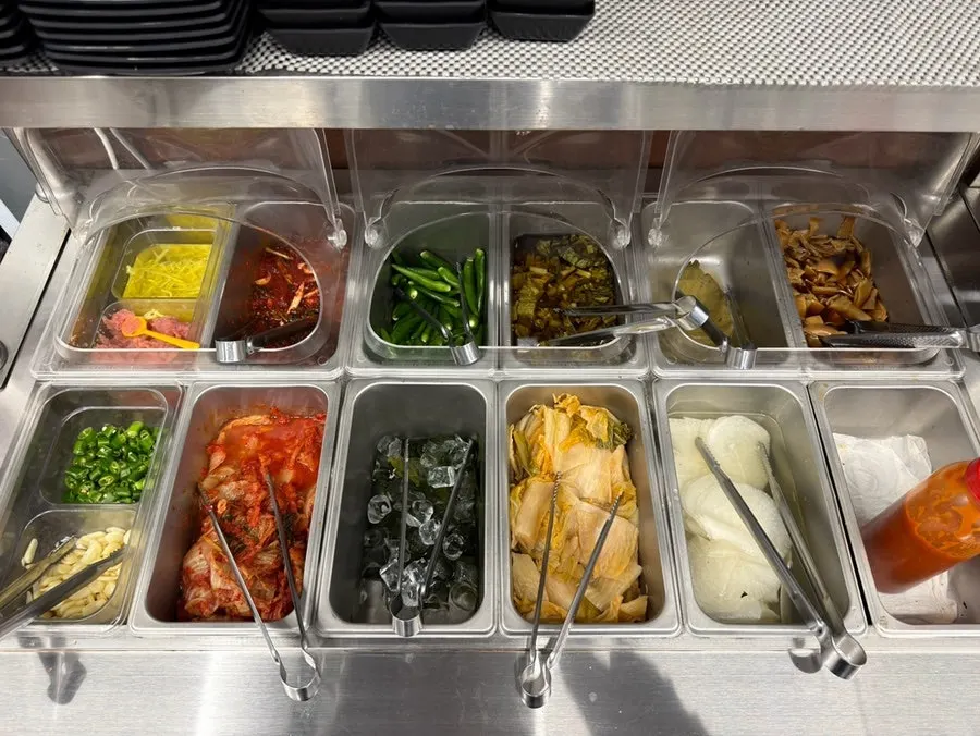 Self-serve bar stocked with side dishes