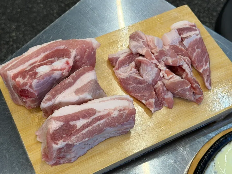 A plate of thickly sliced raw meat
