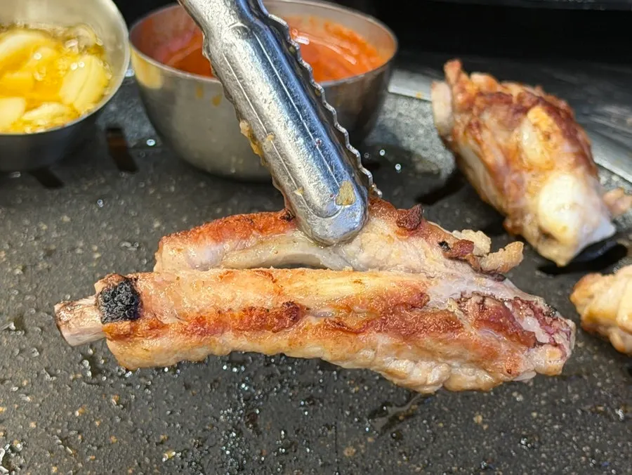 A piece of meat dipped in salted pollock roe