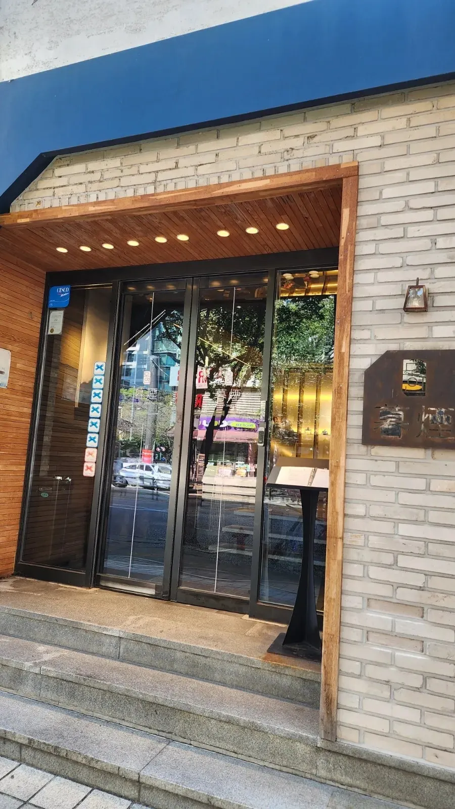 Entrance to Moyeon Mapo with Blue Ribbon stickers on the door