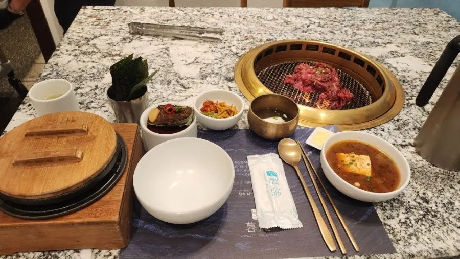 Grill plate and tableware set on a marble table
