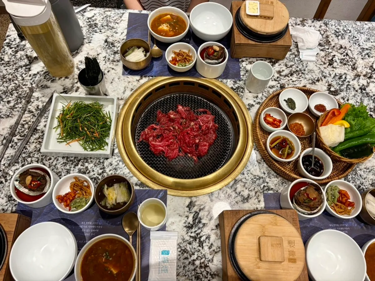 Full table spread of the charcoal-grilled hanwoo bulgogi pot rice set