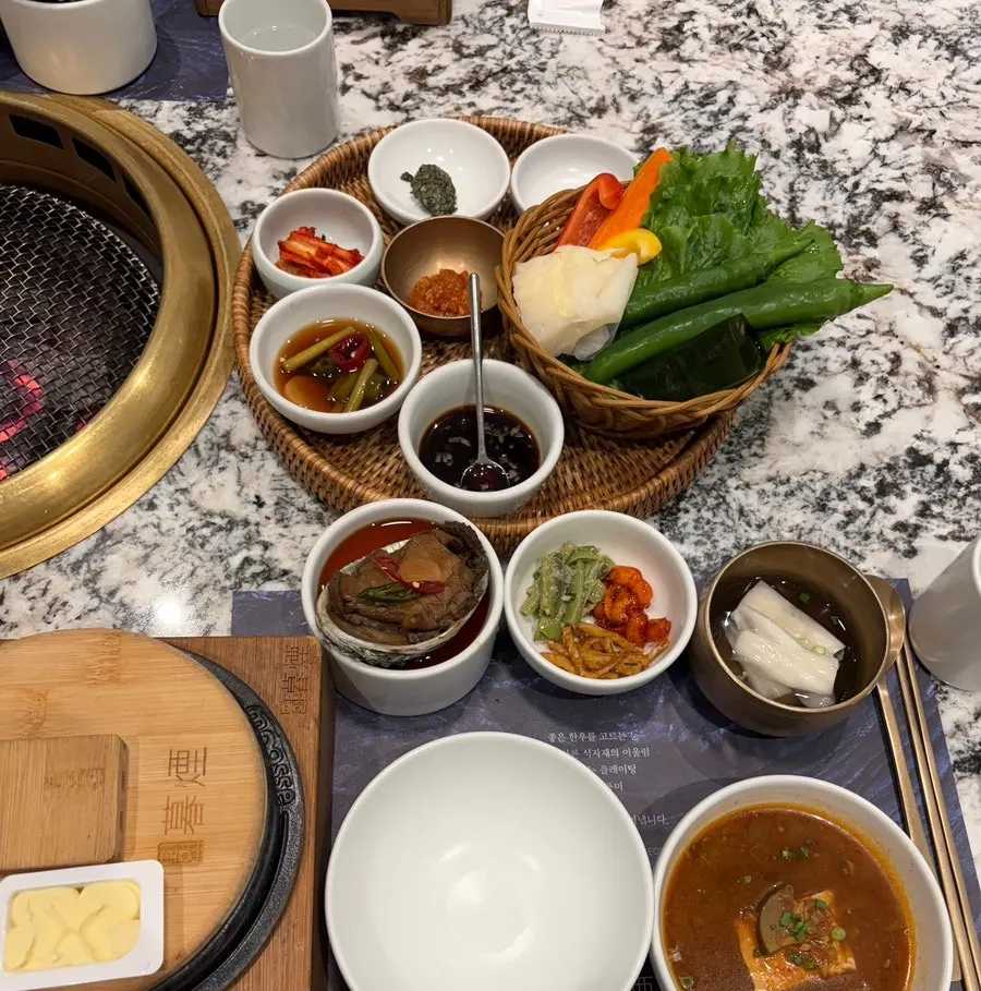 Staff member performing the tableside grilling service