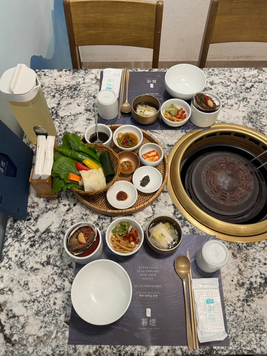 Table setting and charcoal grill in the private room at Moyeon Mapo