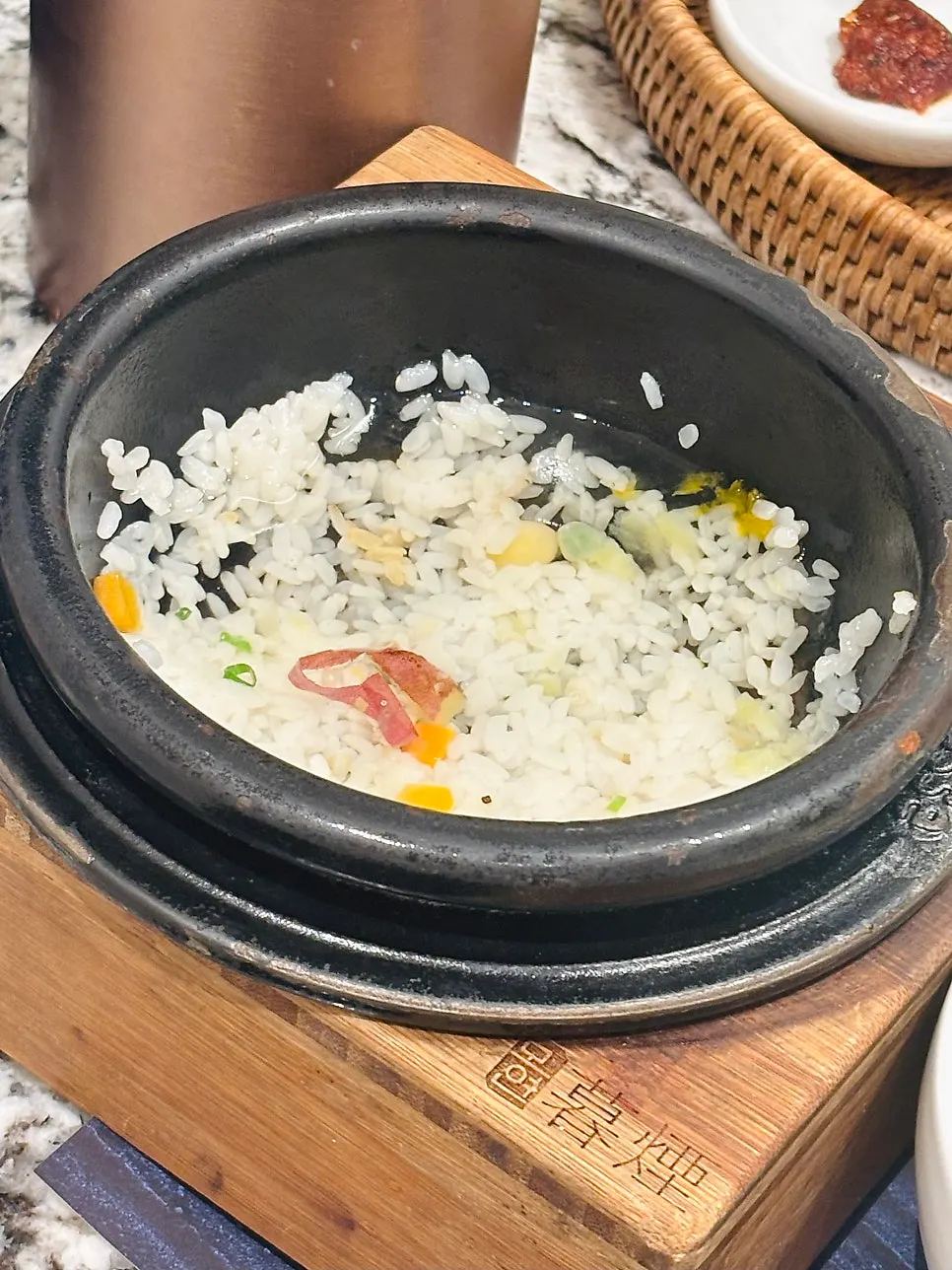 Bowl of scooped rice with soy-braised abalone