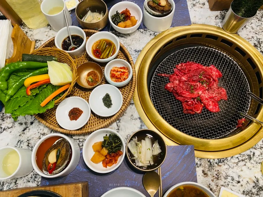 Plate of charcoal-grilled seasoned hanwoo beef before cooking