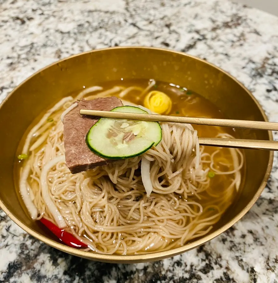 Bowl of pyeongyang naengmyeon with hanwoo broth and pure buckwheat noodles