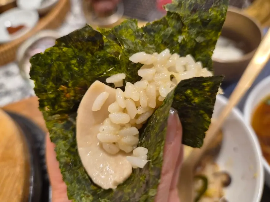A bowl of rice mixed with braised abalone and butter