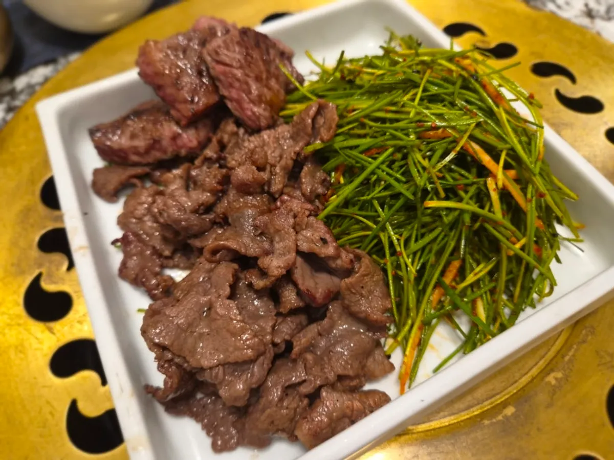 A piece of hanwoo sirloin dipped in salt
