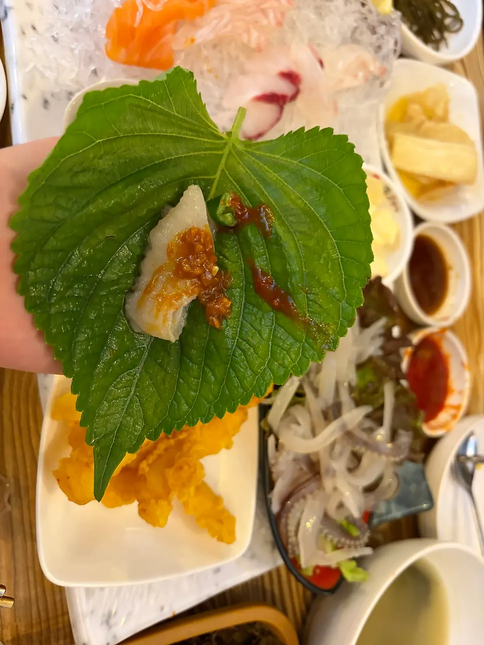Plate of live fish sashimi served with the set