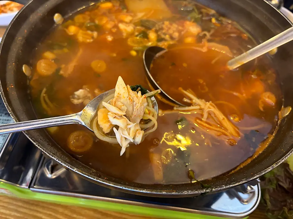 Pot of seafood spicy stew boiling