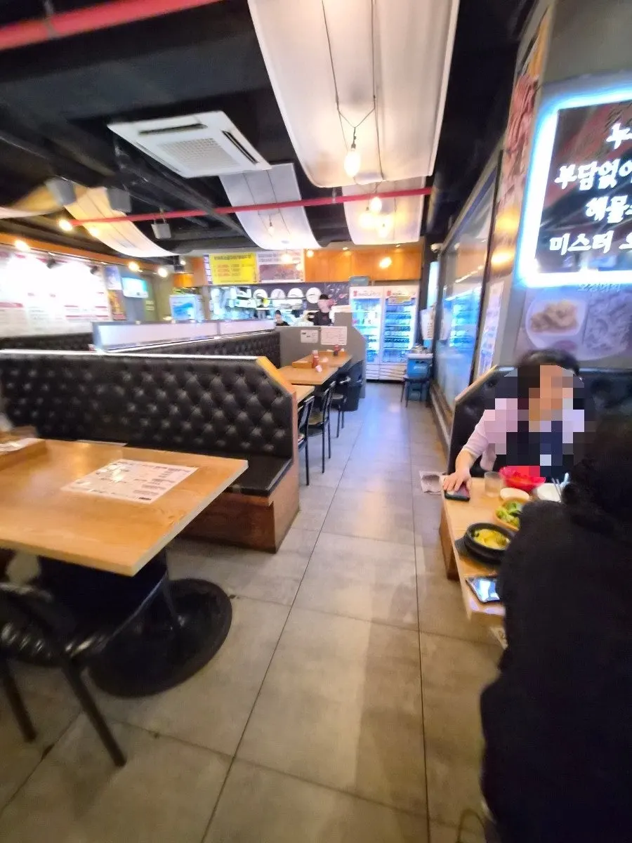 Full view of the Mr. Squid dining room with generous table spacing
