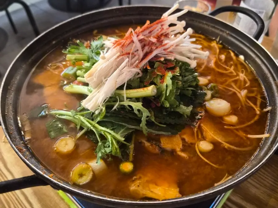 Pot of spicy stew served as a free extra