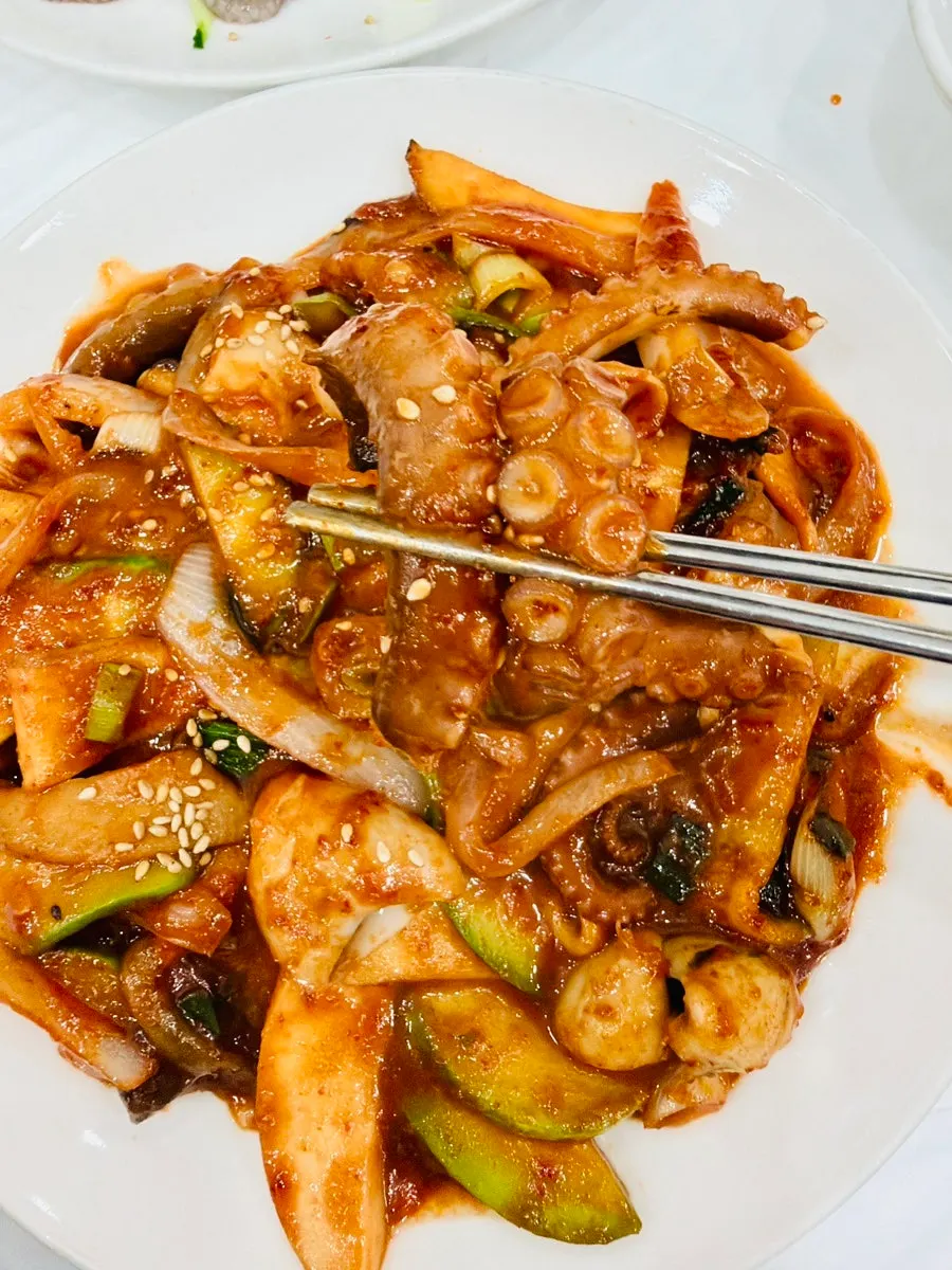 Stir-fried octopus with roasted seaweed flakes and rice