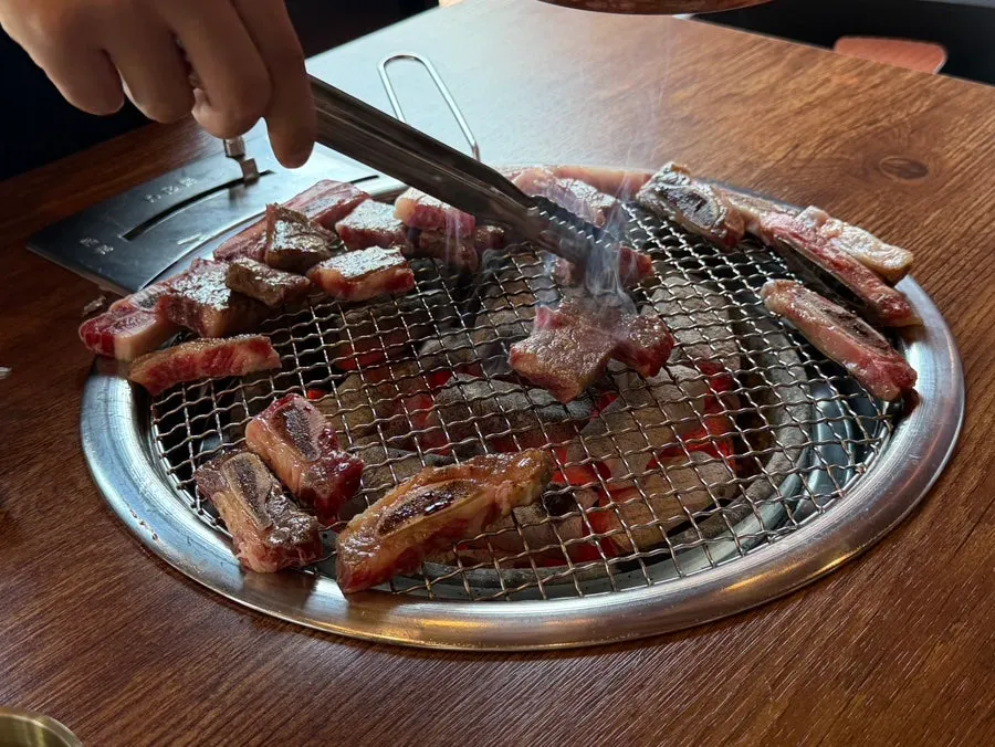 Staff grilling fresh beef ribs