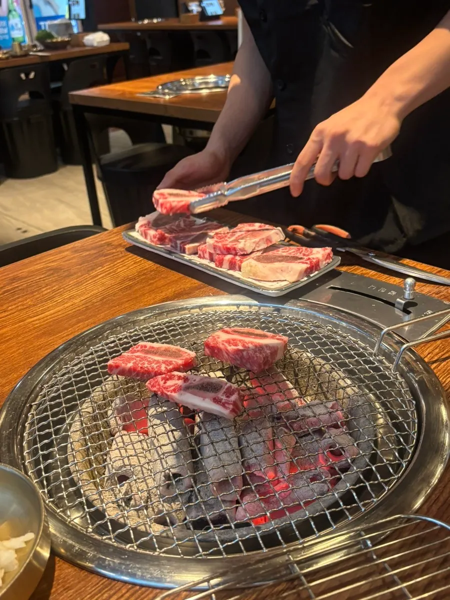 A plate of fresh beef ribs showing marbling