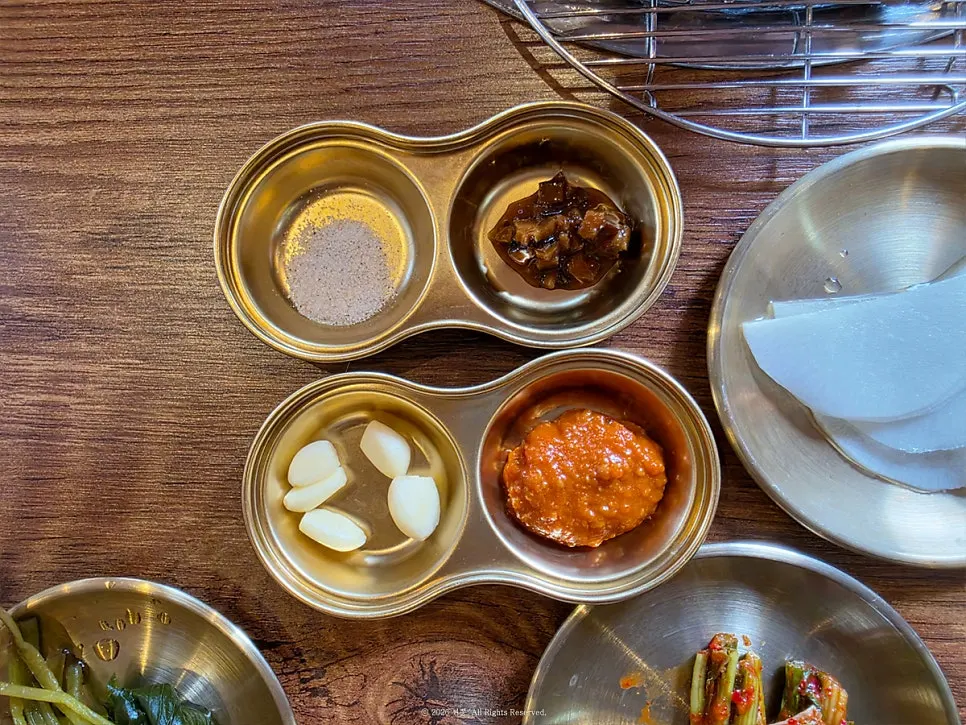 Table setting with pickled radish and seasoning sauce