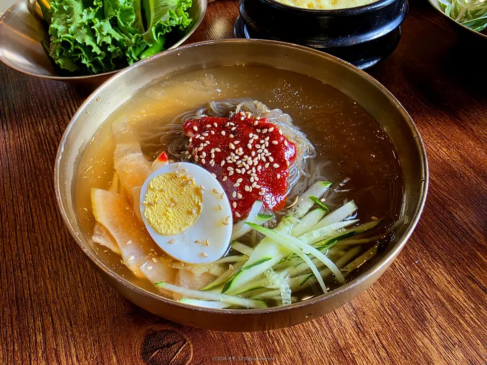 A bowl of water naengmyeon boiled fresh to order