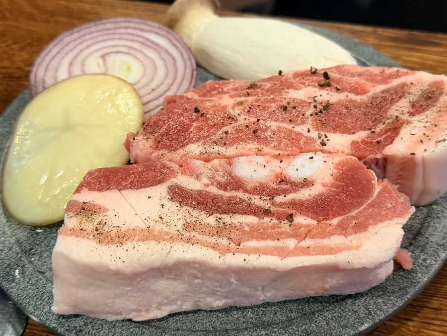 Raw thick pork neck and pork belly that were ordered