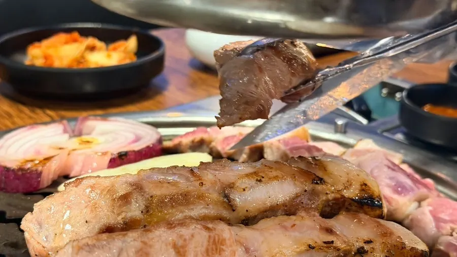 Pork neck and pork belly grilling on the pan