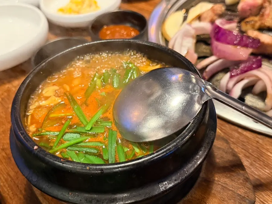 Muttuk Ilpum Doenjang Jjigae packed with tofu and vegetables
