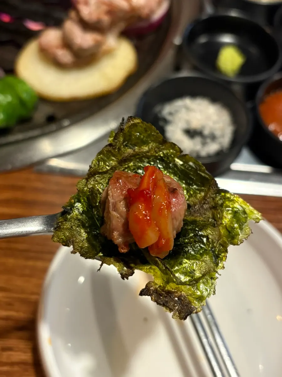 Charcoal-roasted gim wrapped around meat and squid jeotgal