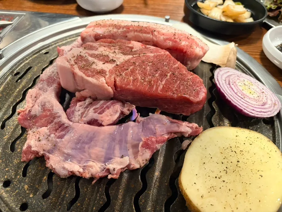 Meat grilled and cut into pieces by the staff