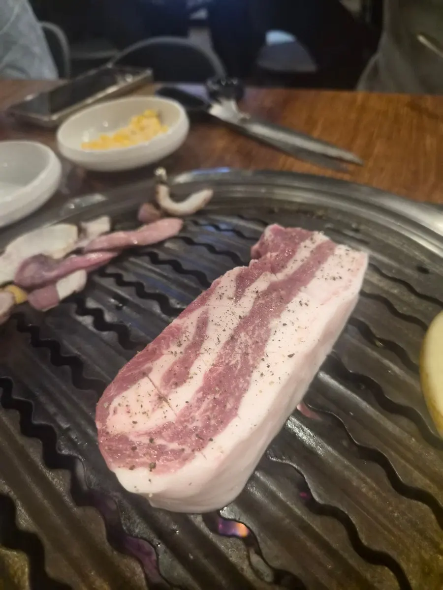Plate of raw odol pork belly, one serving