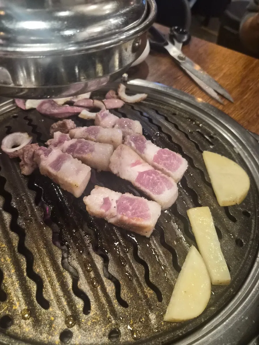 Odol pork belly cooking on the grill