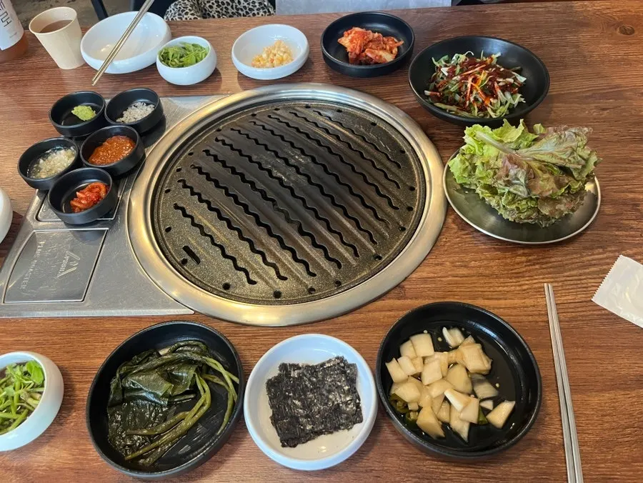 Full spread of basic side dishes on the table at Muttuk Sookdae Main Branch