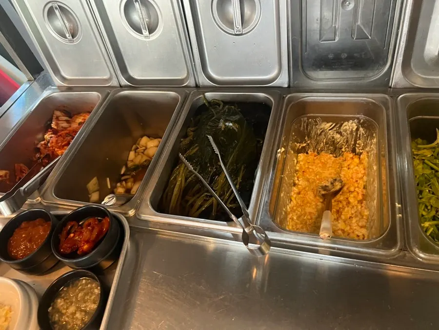 Containers of side dishes at the self-bar