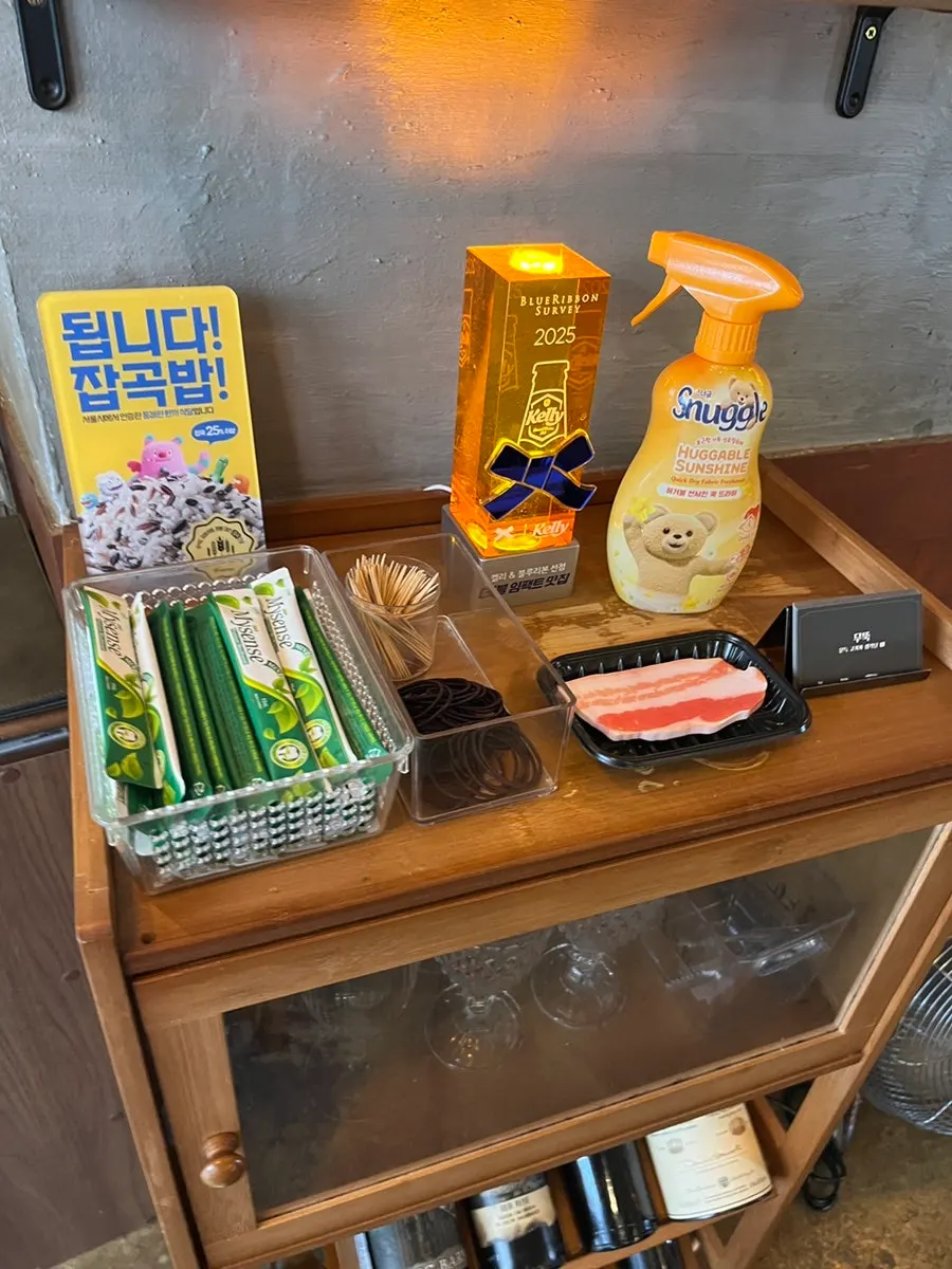 Deodorant spray, mouthwash, and hair ties next to the register
